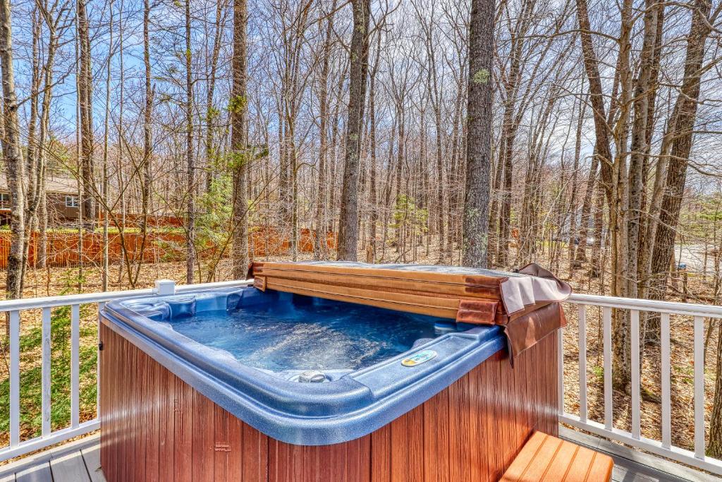 a hot tub on the back of a deck at 116 Red Ridge Lane in Conway