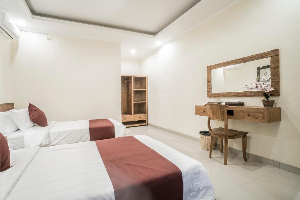 Postel nebo postele na pokoji v ubytování Sriwedari 40 Ubud