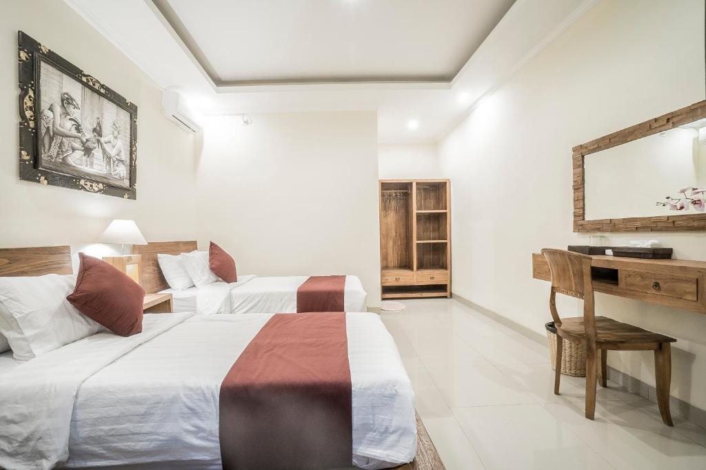 Postel nebo postele na pokoji v ubytování Sriwedari 40 Ubud