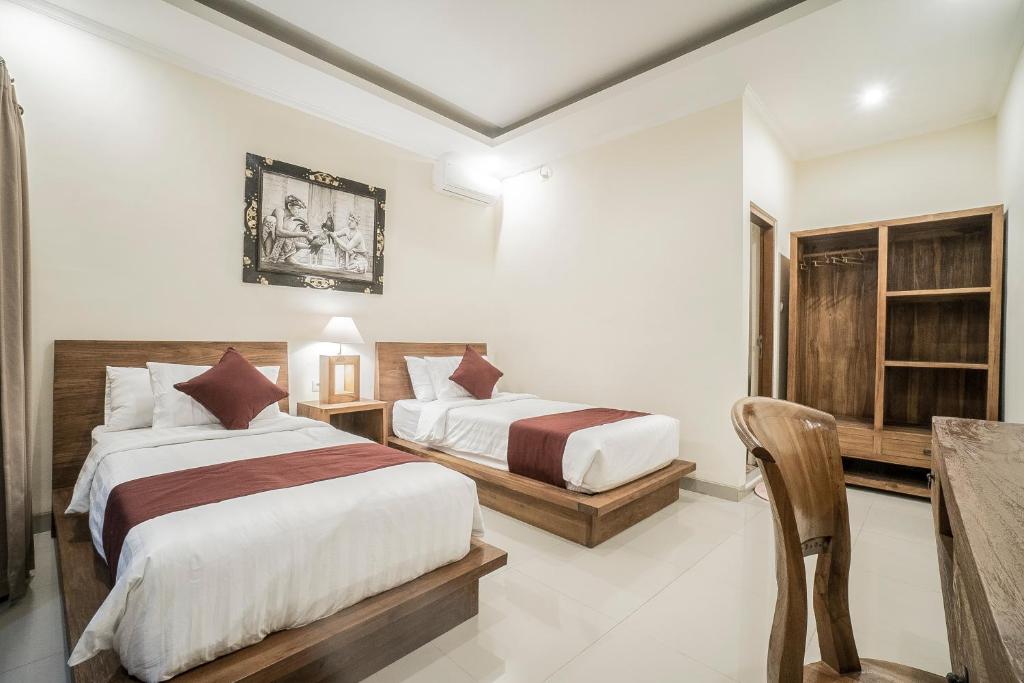 Postel nebo postele na pokoji v ubytování Sriwedari 40 Ubud
