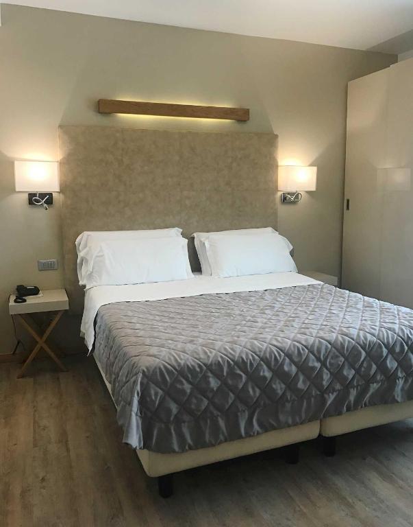 Postel nebo postele na pokoji v ubytování Hotel Le Soleil