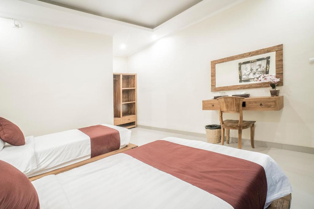 Postel nebo postele na pokoji v ubytování Sriwedari 40 Ubud