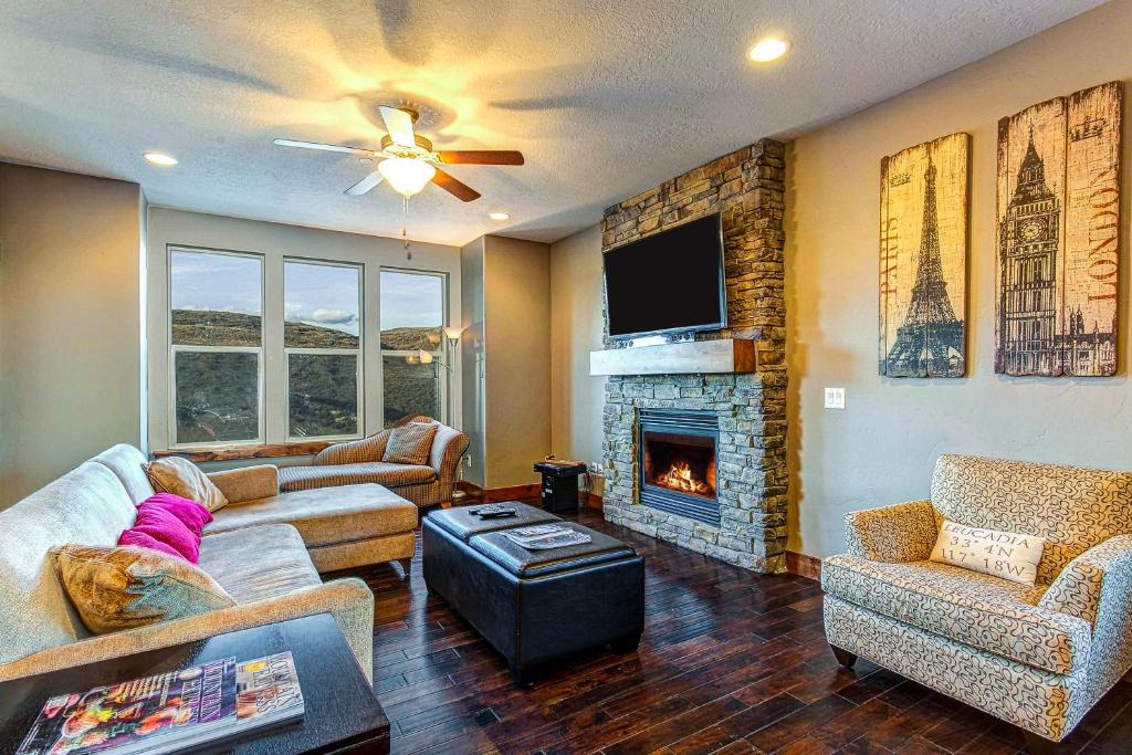 a living room with a couch and a fireplace at The Retreat in Keetley Junction