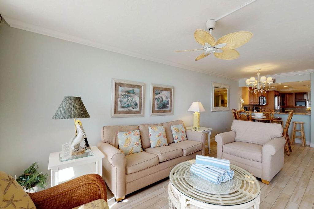 a living room with a couch and a table at Anna Maria Island Club Unit17S in Holmes Beach
