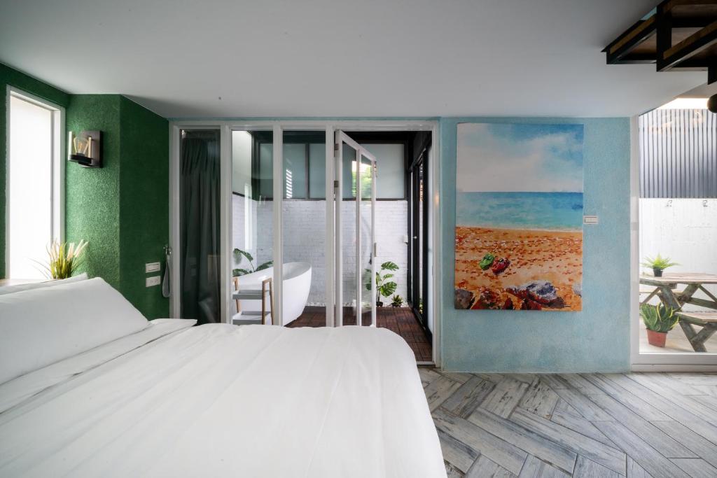 Postel nebo postele na pokoji v ubytování Color Coral Boutique Hotel