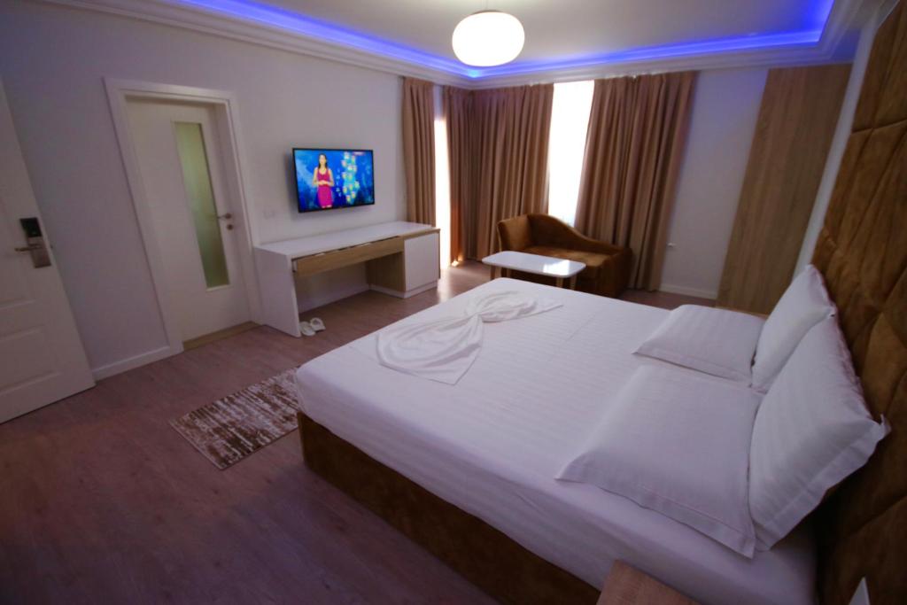 Postel nebo postele na pokoji v ubytování ELJOS HOTEL