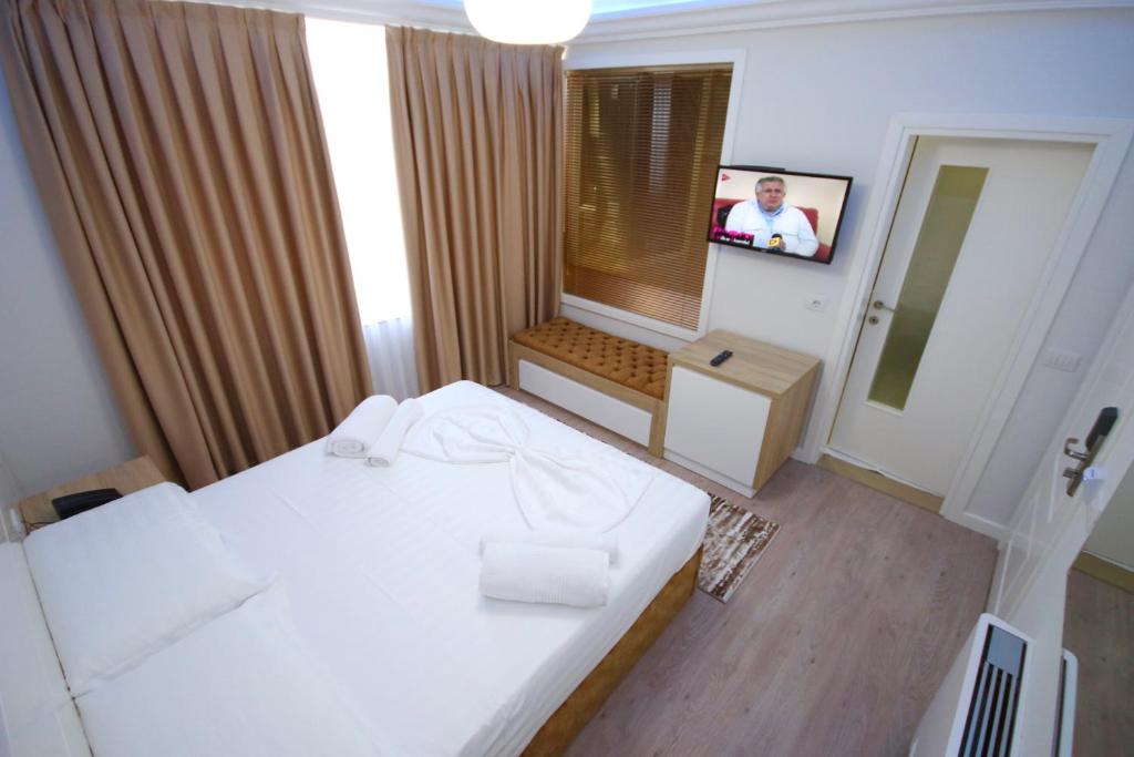 Postel nebo postele na pokoji v ubytování ELJOS HOTEL