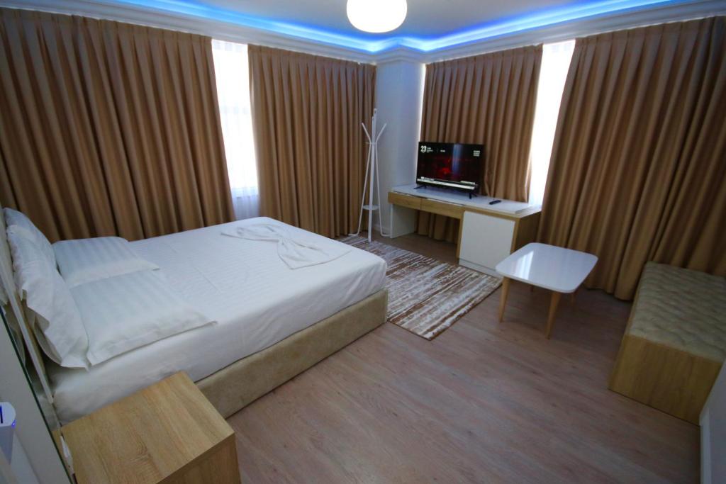 TV a/nebo společenská místnost v ubytování ELJOS HOTEL