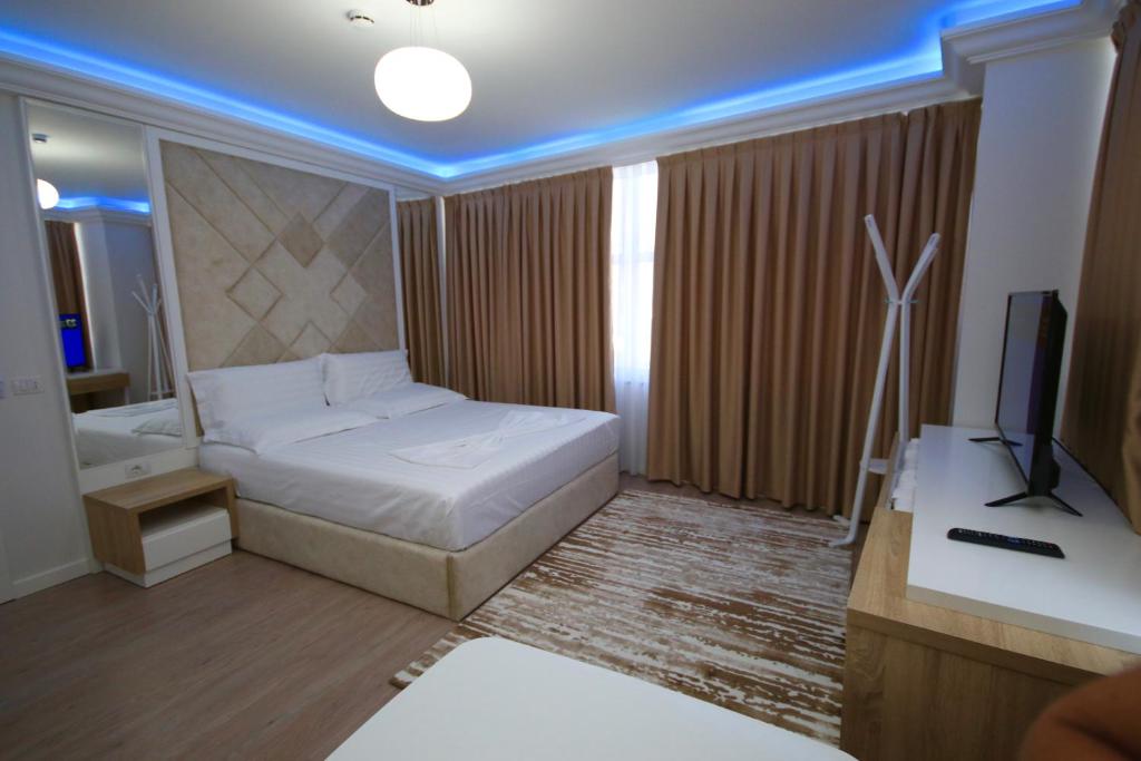 Postel nebo postele na pokoji v ubytování ELJOS HOTEL