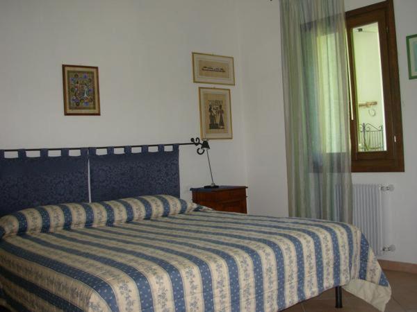 Giường trong phòng chung tại B&B La Casa in Collina