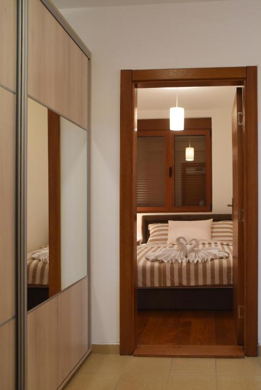 Postel nebo postele na pokoji v ubytování Apartman Nensy