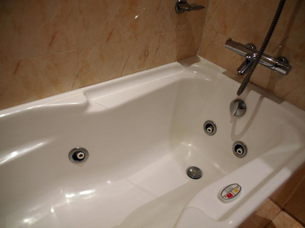 Vannituba majutusasutuses Hotel Guillem & Spa