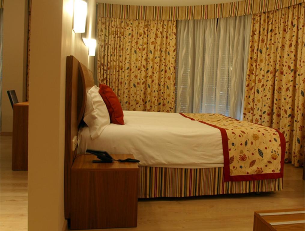 Voodi või voodid majutusasutuse Hotel Guillem & Spa toas