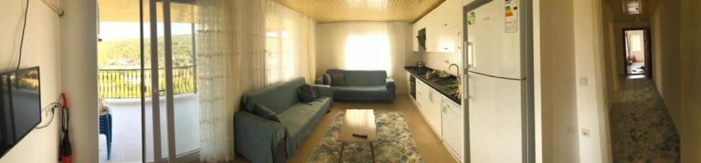 A television and/or entertainment centre at Demir Apart-Otel