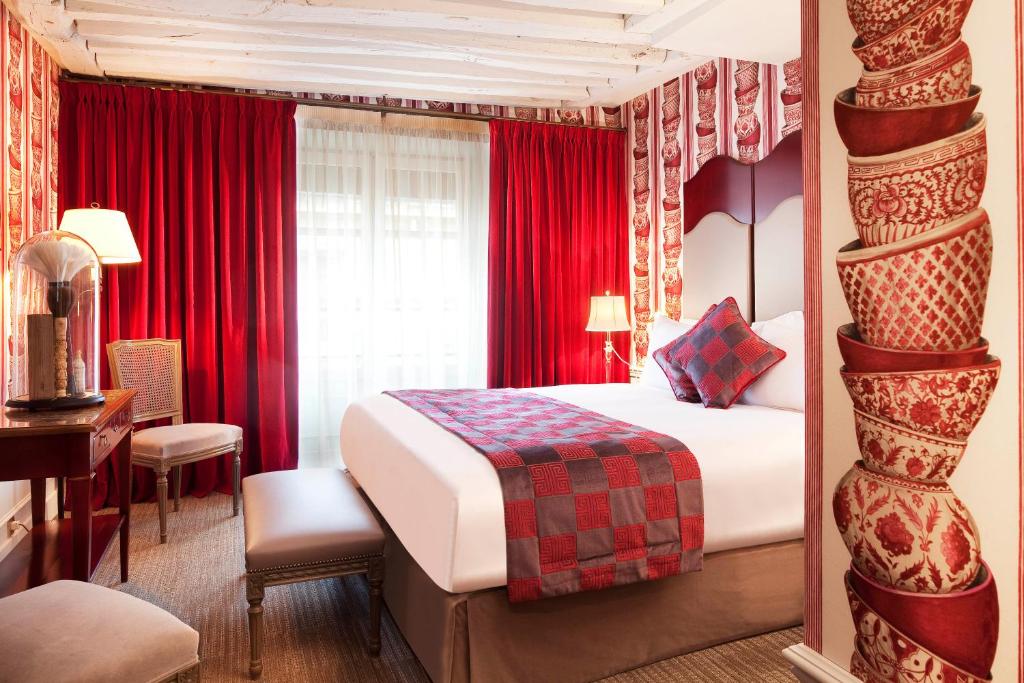 Postel nebo postele na pokoji v ubytování La Maison Favart