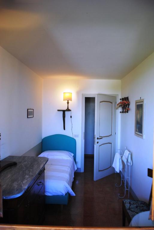 Łóżko lub łóżka w pokoju w obiekcie "Alle Montanine" Villa Poggio