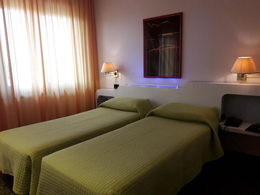 Postel nebo postele na pokoji v ubytování Hotel Motel K