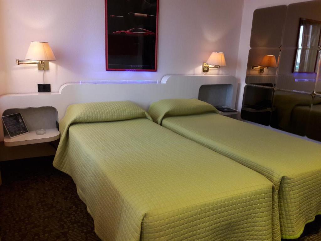 Postel nebo postele na pokoji v ubytování Hotel Motel K
