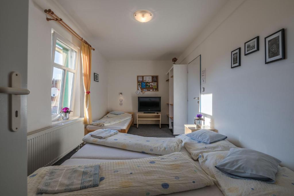 Postel nebo postele na pokoji v ubytování Penzion Slunečnice