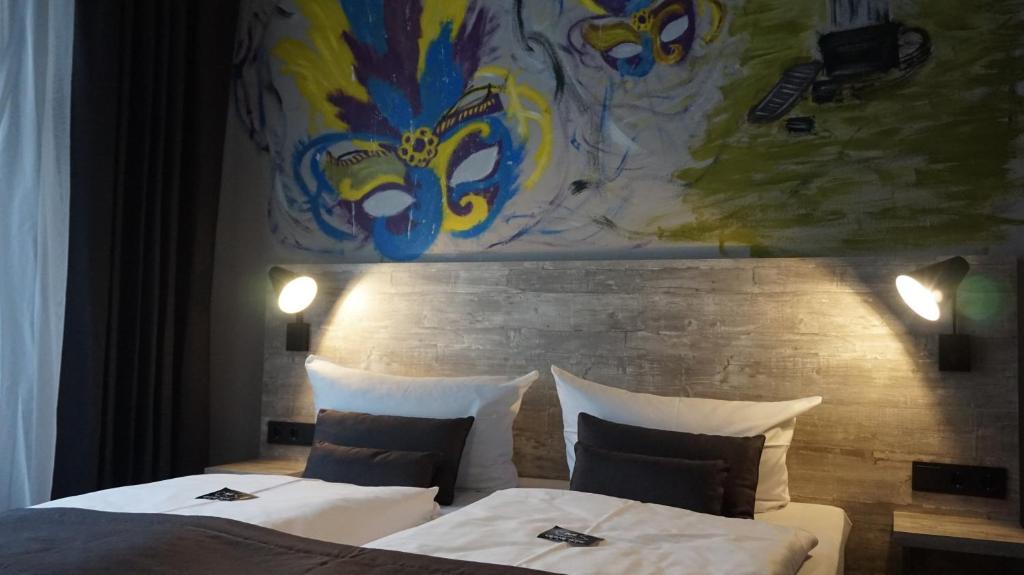 Postel nebo postele na pokoji v ubytování Urban Home Hotel