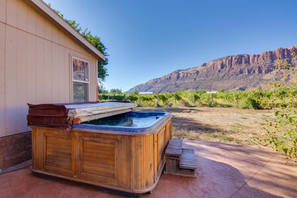a hot tub sitting on the side of a house at Spanish Valley Vinyard in Moab