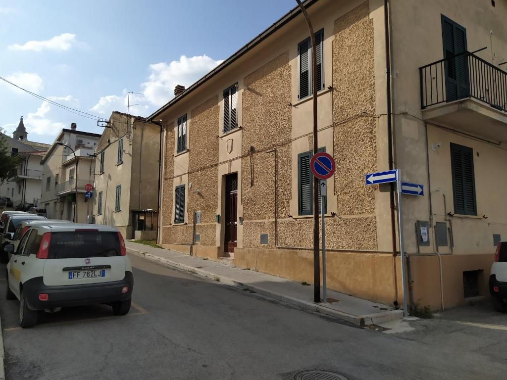 a white car parked on a street next to a building at Come a Casa - Like home in Tocco da Casauria