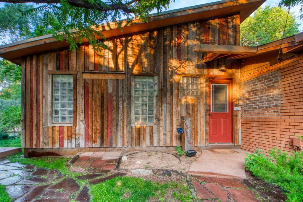 an old brick house with a red door at Creekside Cowa-Bungalow! in Moab