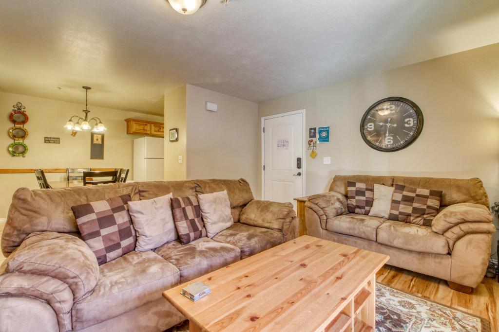 a living room with two couches and a coffee table at Red Cliff 3C in Moab