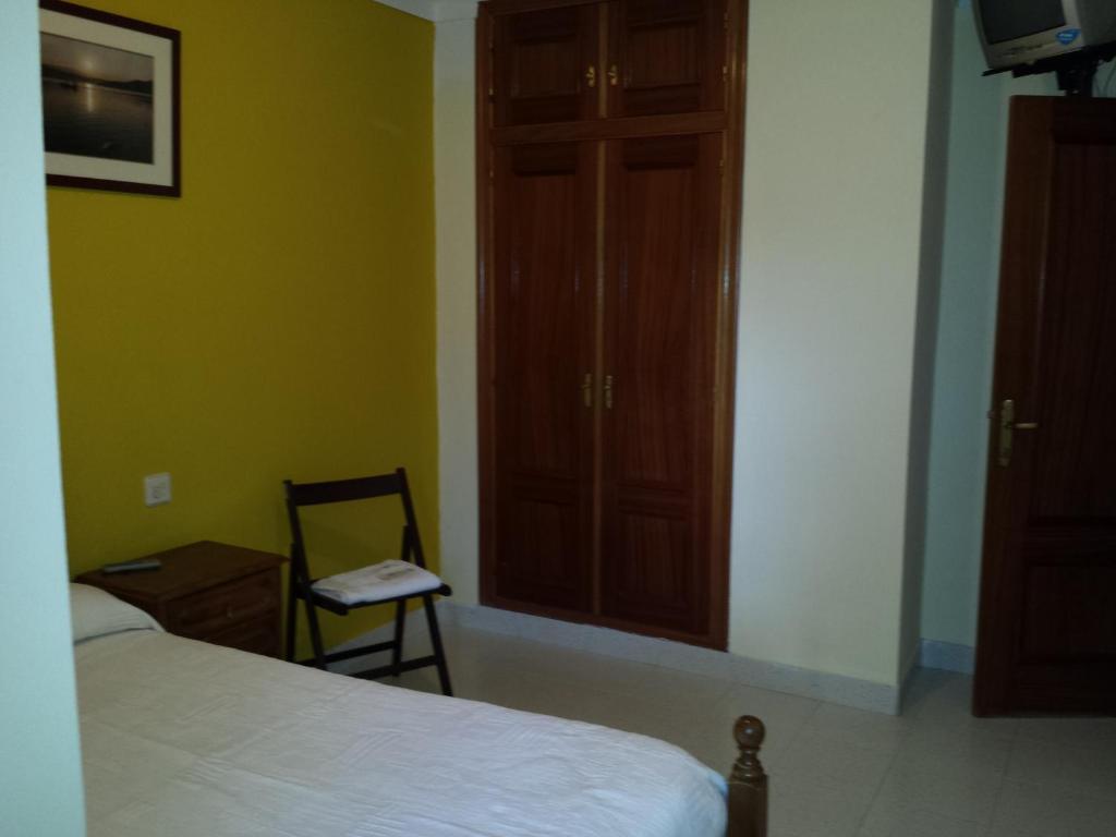 Posteľ alebo postele v izbe v ubytovaní Hostal Atila