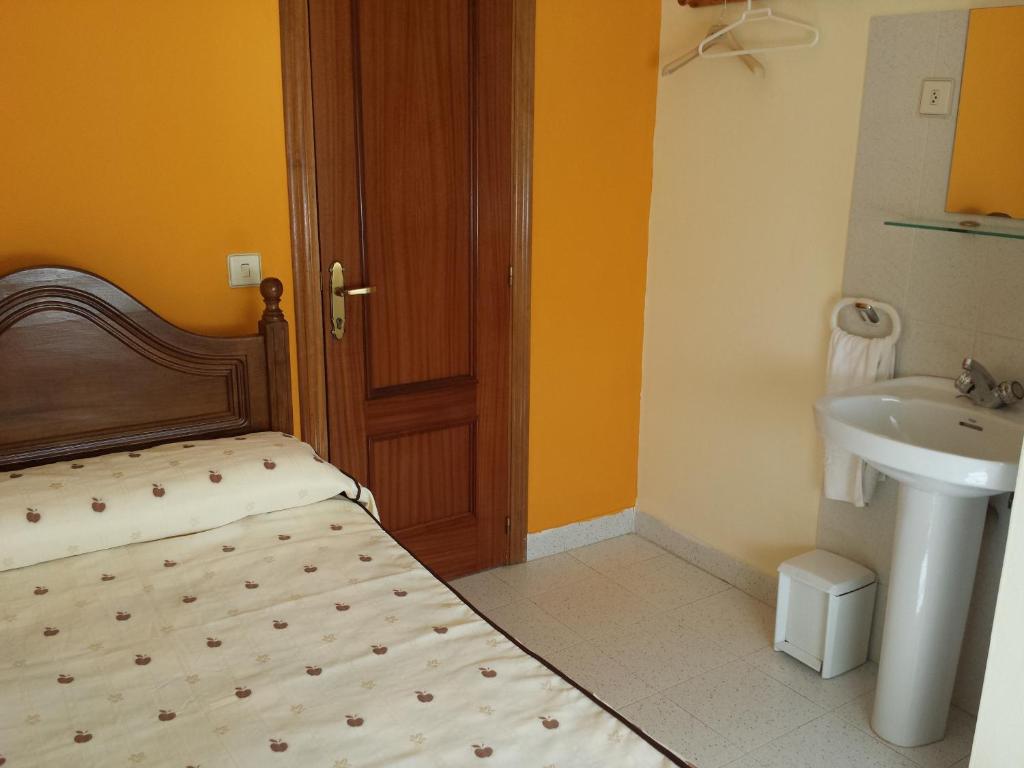 Posteľ alebo postele v izbe v ubytovaní Hostal Atila