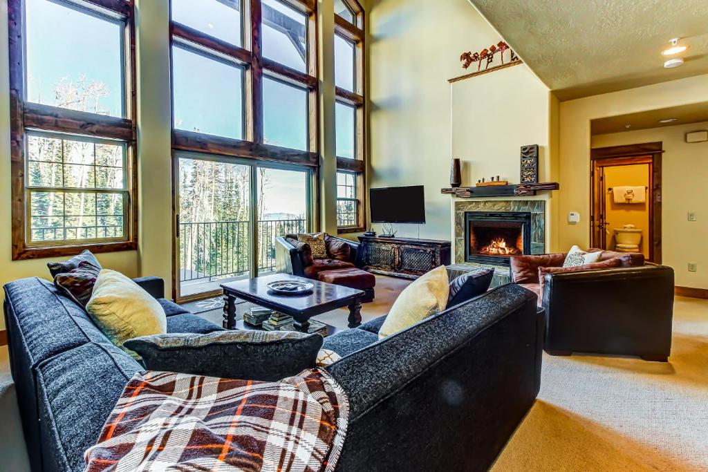a living room with two couches and a fireplace at White Bear #B12 - Heavenly Bear at White Bear in Brian Head