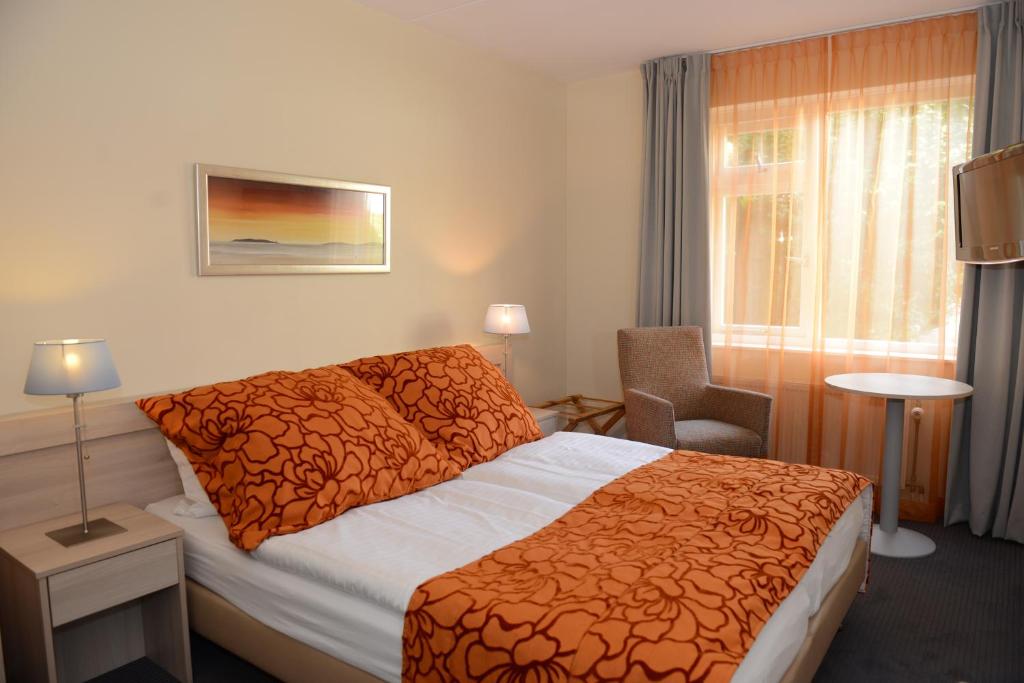Postel nebo postele na pokoji v ubytování Hotel Op Diek