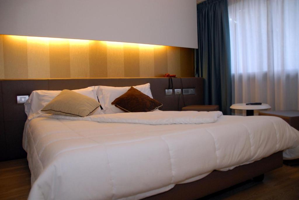 Postel nebo postele na pokoji v ubytování Green Hotel Motel