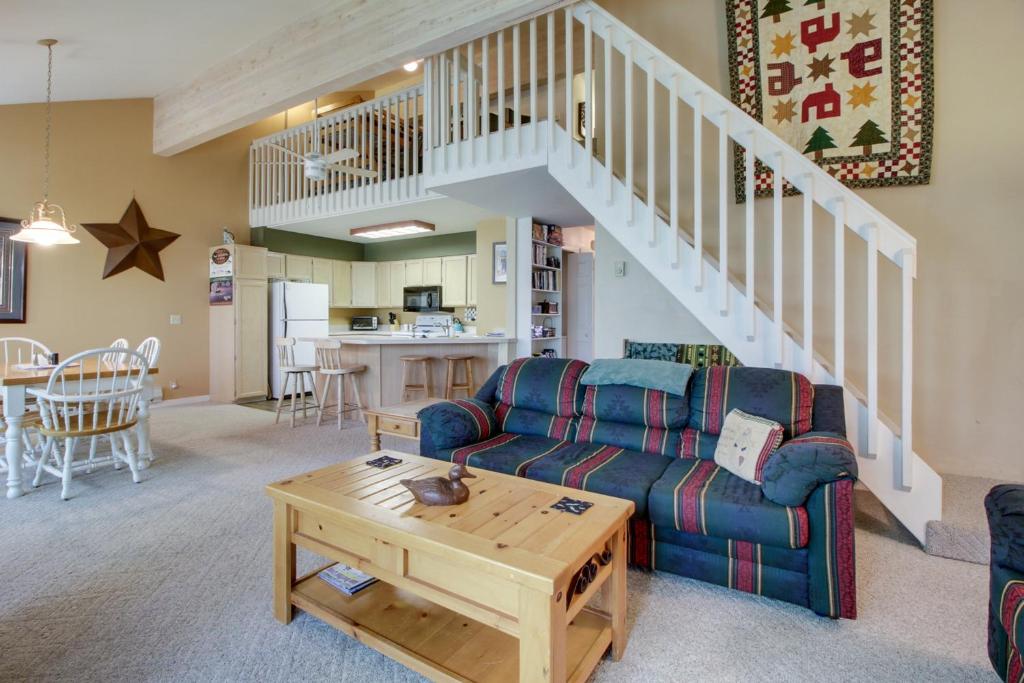 a living room with a couch and a table at Aspen Village #103 in McCall