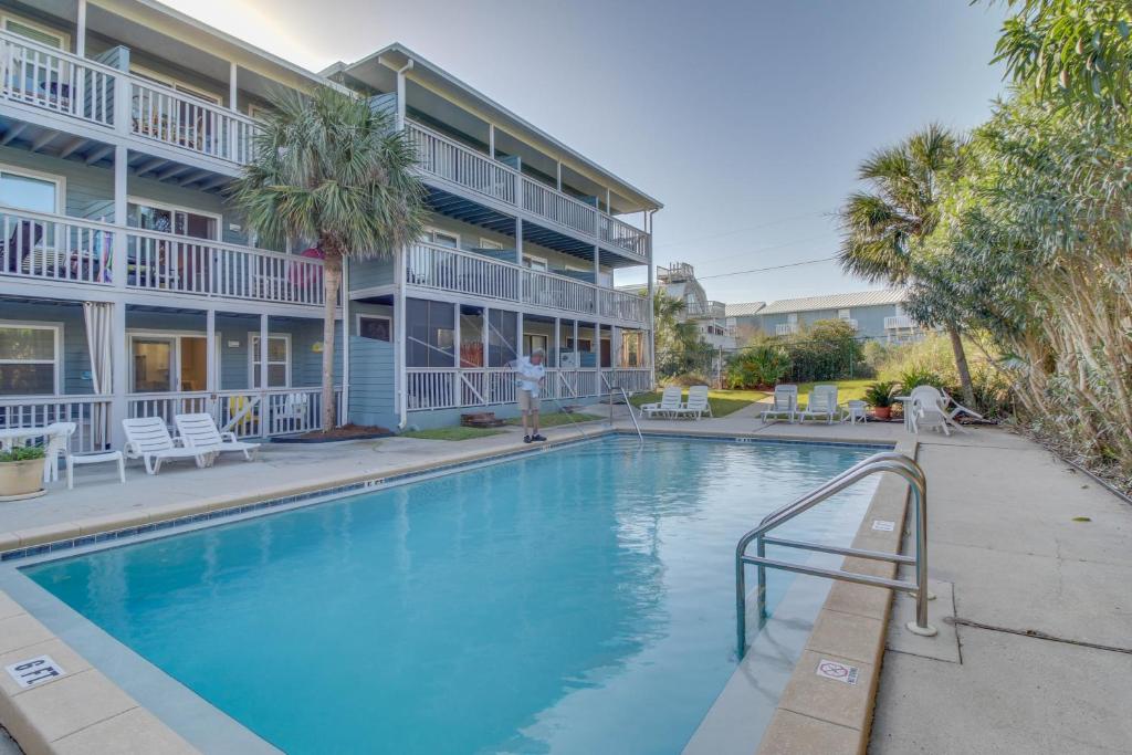 a swimming pool in front of a building at 104 Inlet Sands Condo in Inlet Beach