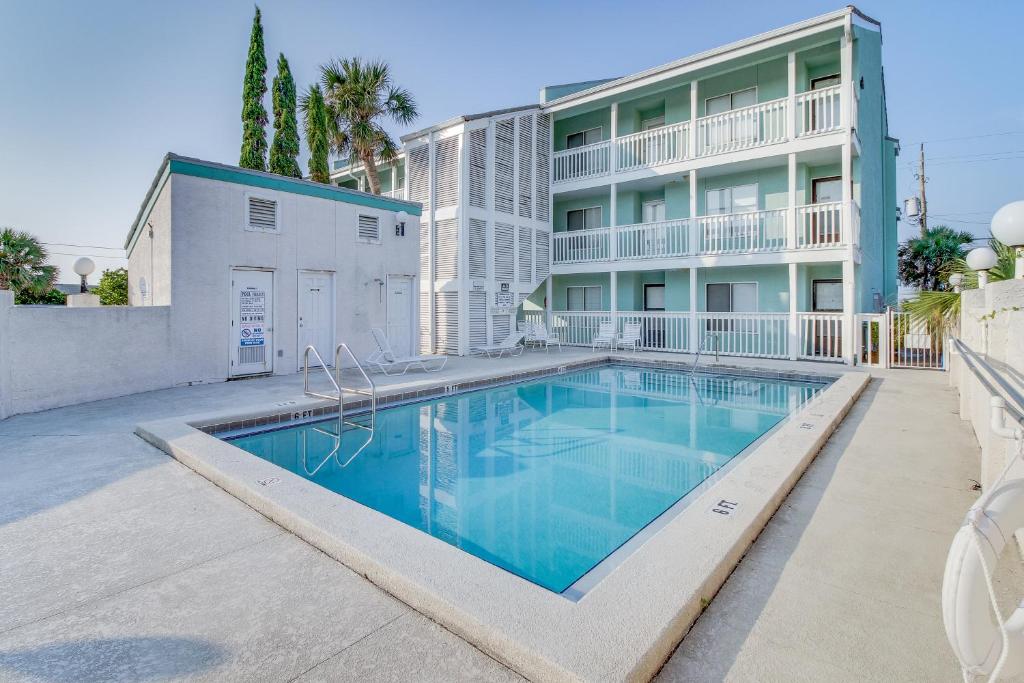 a swimming pool in front of a building at Emerald Shores #3006 in Laguna Beach