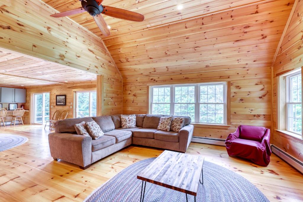 a living room with a couch and a table at Andover Retreat in Ludlow