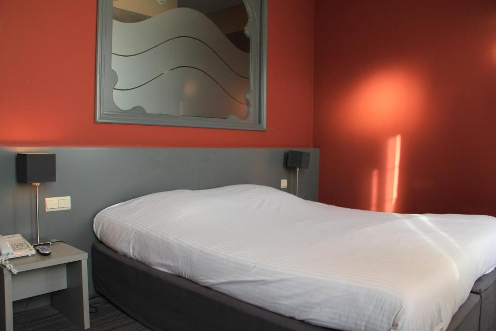 Postel nebo postele na pokoji v ubytování Enjoy Hotel Blankenberge - Pantheon Palace By WP Hotels