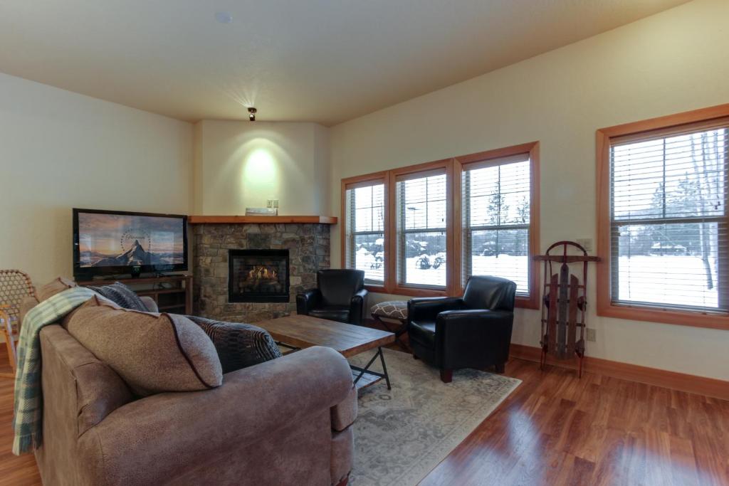 a living room with a couch and a fireplace at Lakeside Haven in Dover