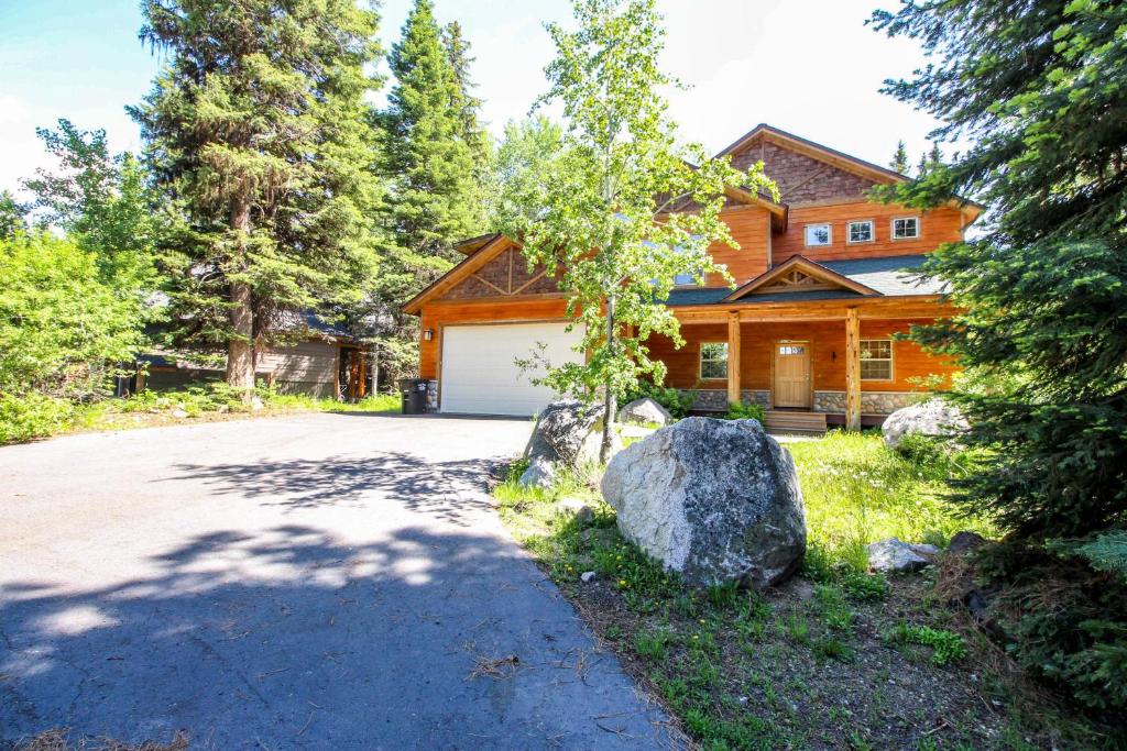 a house with a driveway in front of it at Northern Moose Lodge in McCall