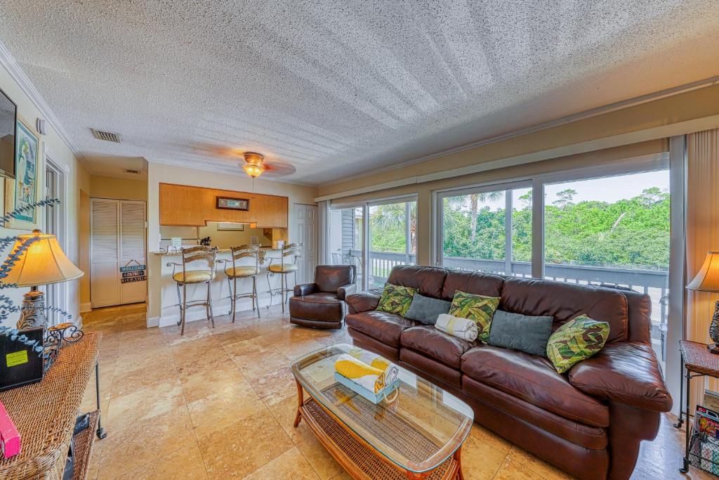 a living room with a couch and a table at Gulf Terrace 287 in Destin