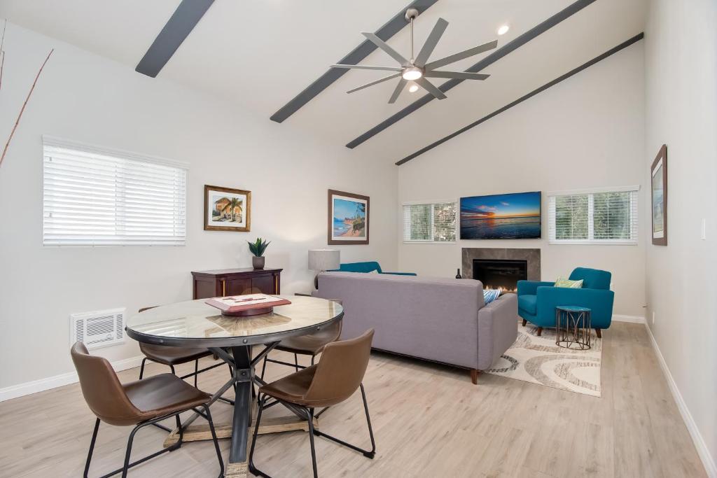 a living room with a table and chairs and a couch at Villa Del Mar in San Clemente