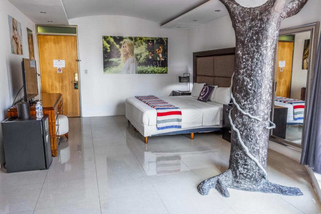 Postel nebo postele na pokoji v ubytování MayaFair Design Hotel