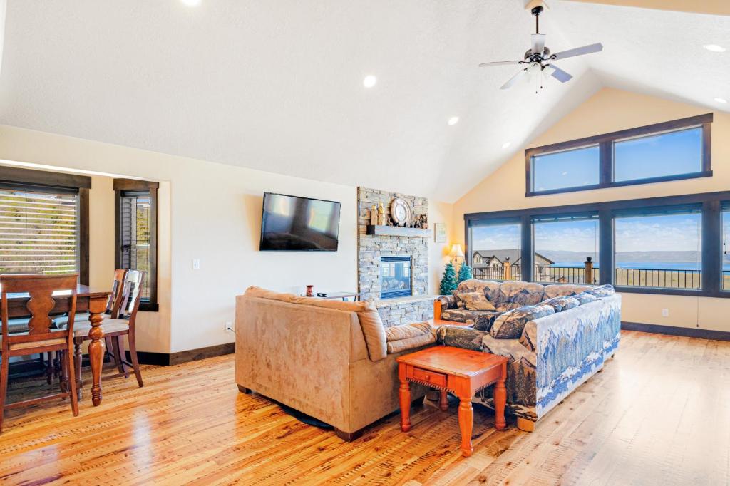 a living room with a couch and a fireplace at Heider Cabin in Garden City
