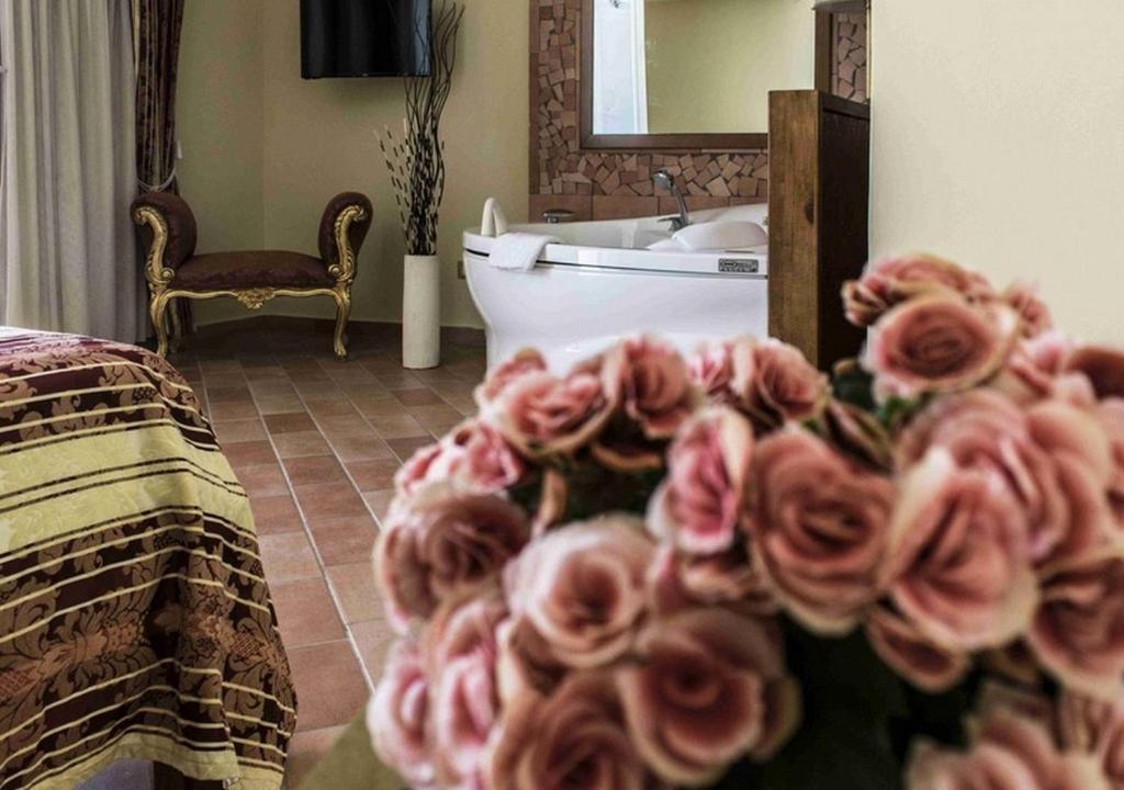 Postel nebo postele na pokoji v ubytování Hotel Baia