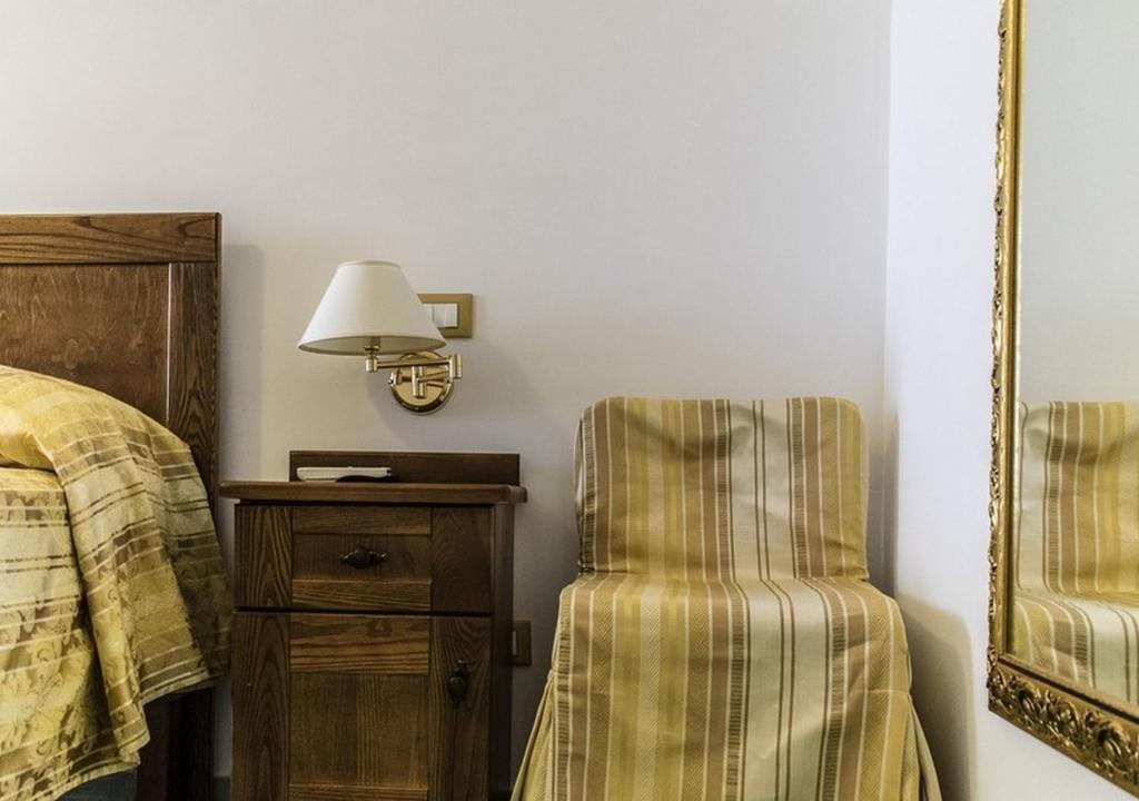Postel nebo postele na pokoji v ubytování Hotel Baia