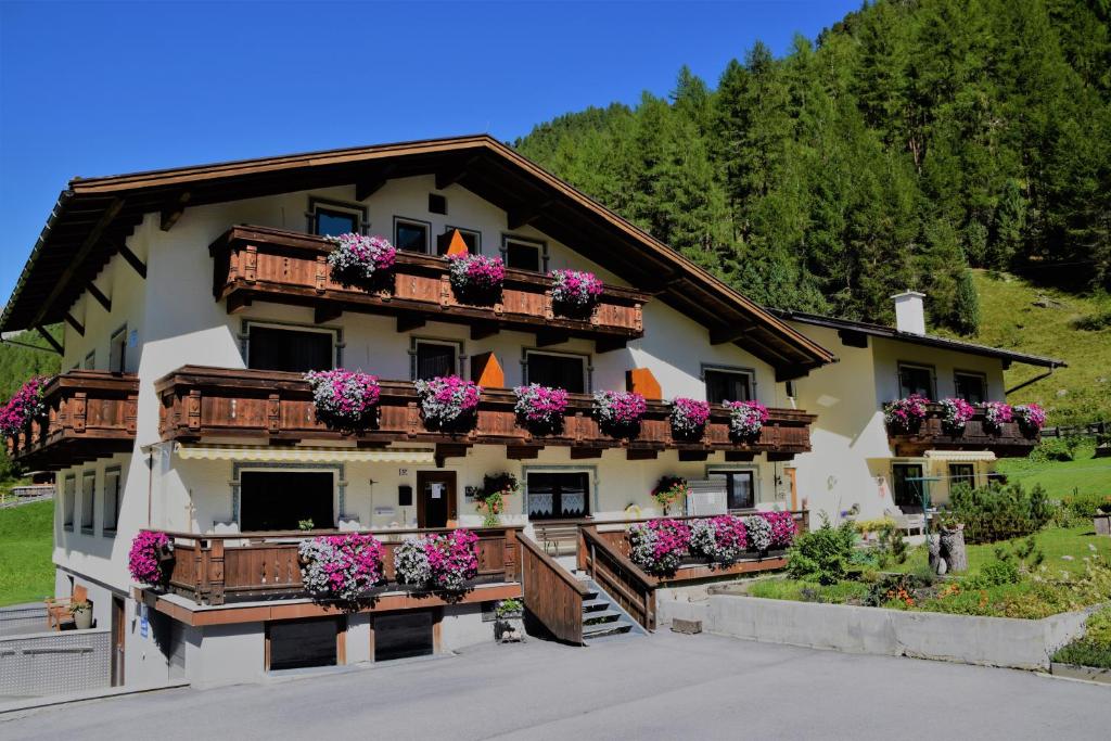 a house with flower boxes on the balconies at Haus Gstrein in Obergurgl