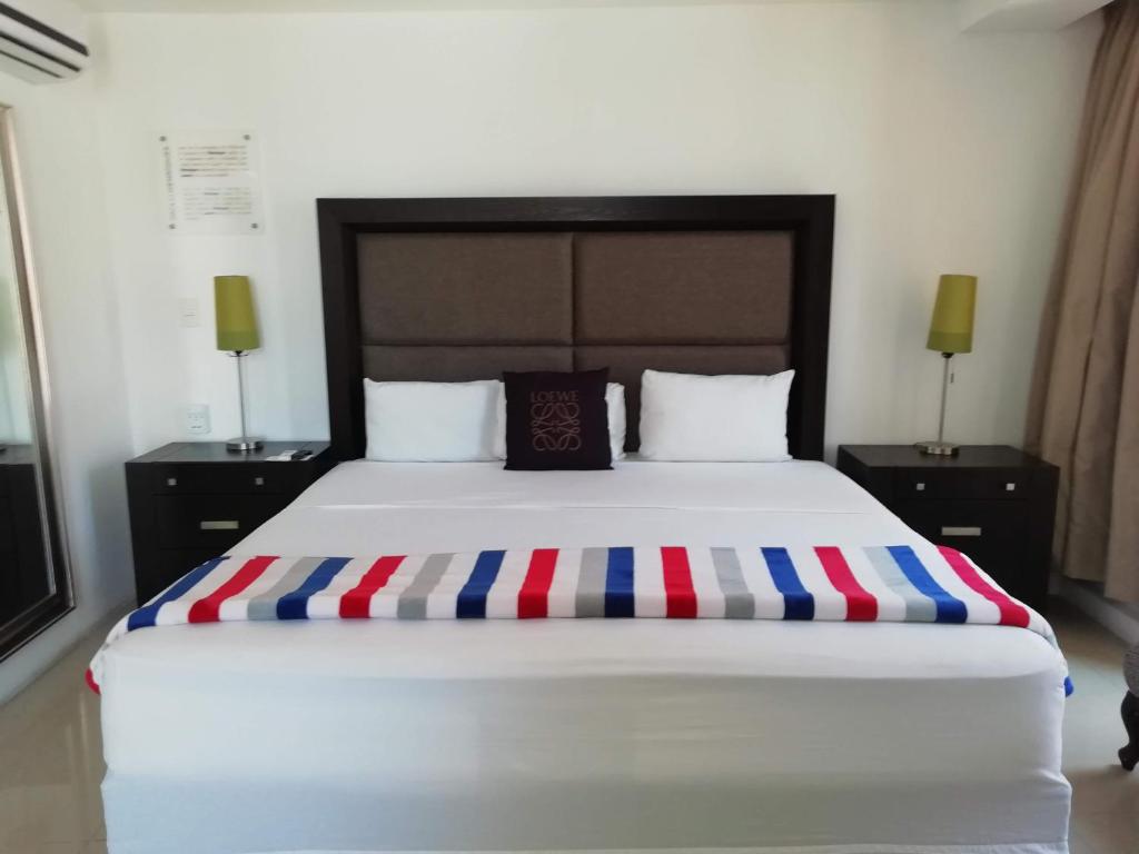 Postel nebo postele na pokoji v ubytování MayaFair Design Hotel