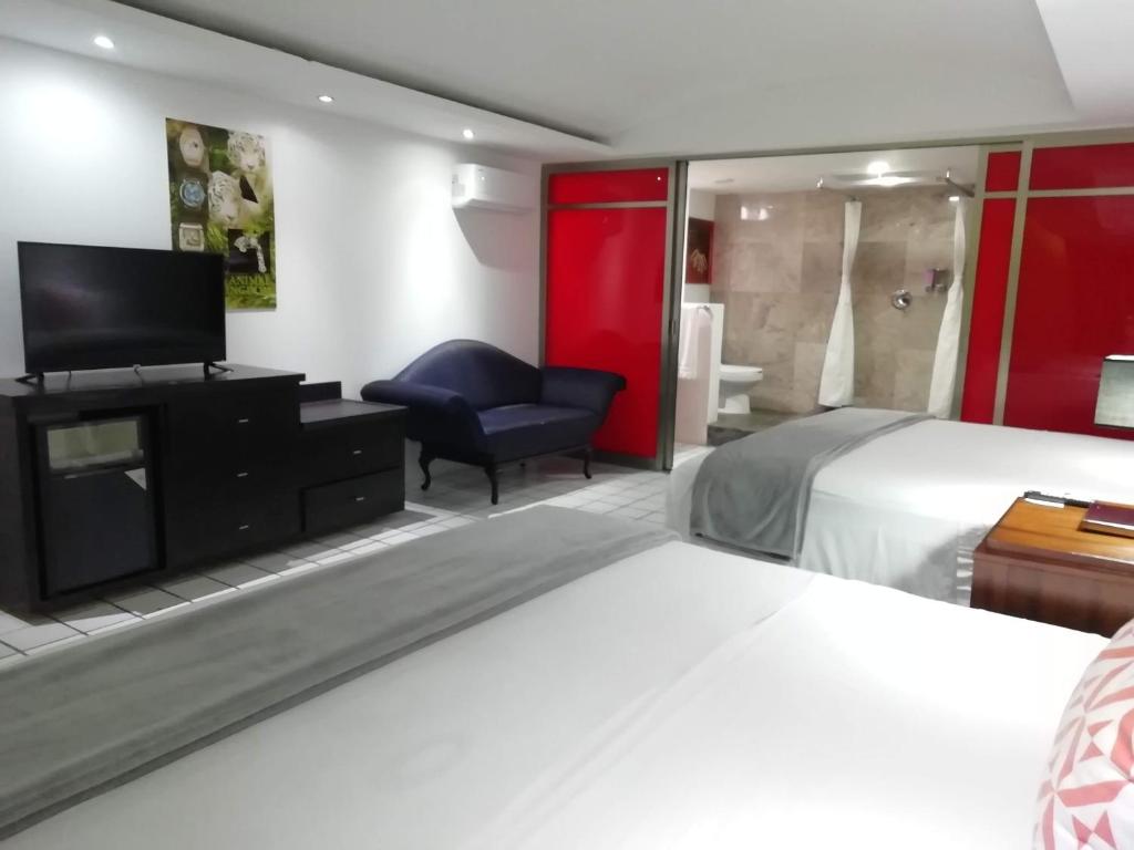 Postel nebo postele na pokoji v ubytování MayaFair Design Hotel