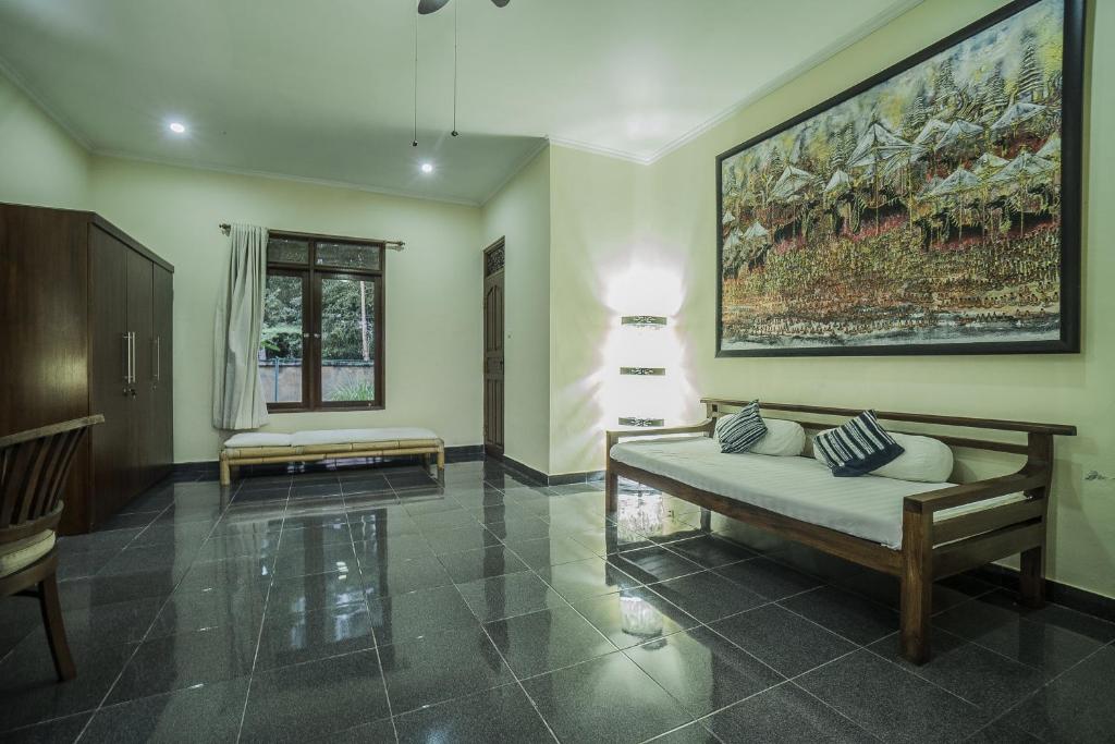 Postel nebo postele na pokoji v ubytování Nyoman Sandi Guest House